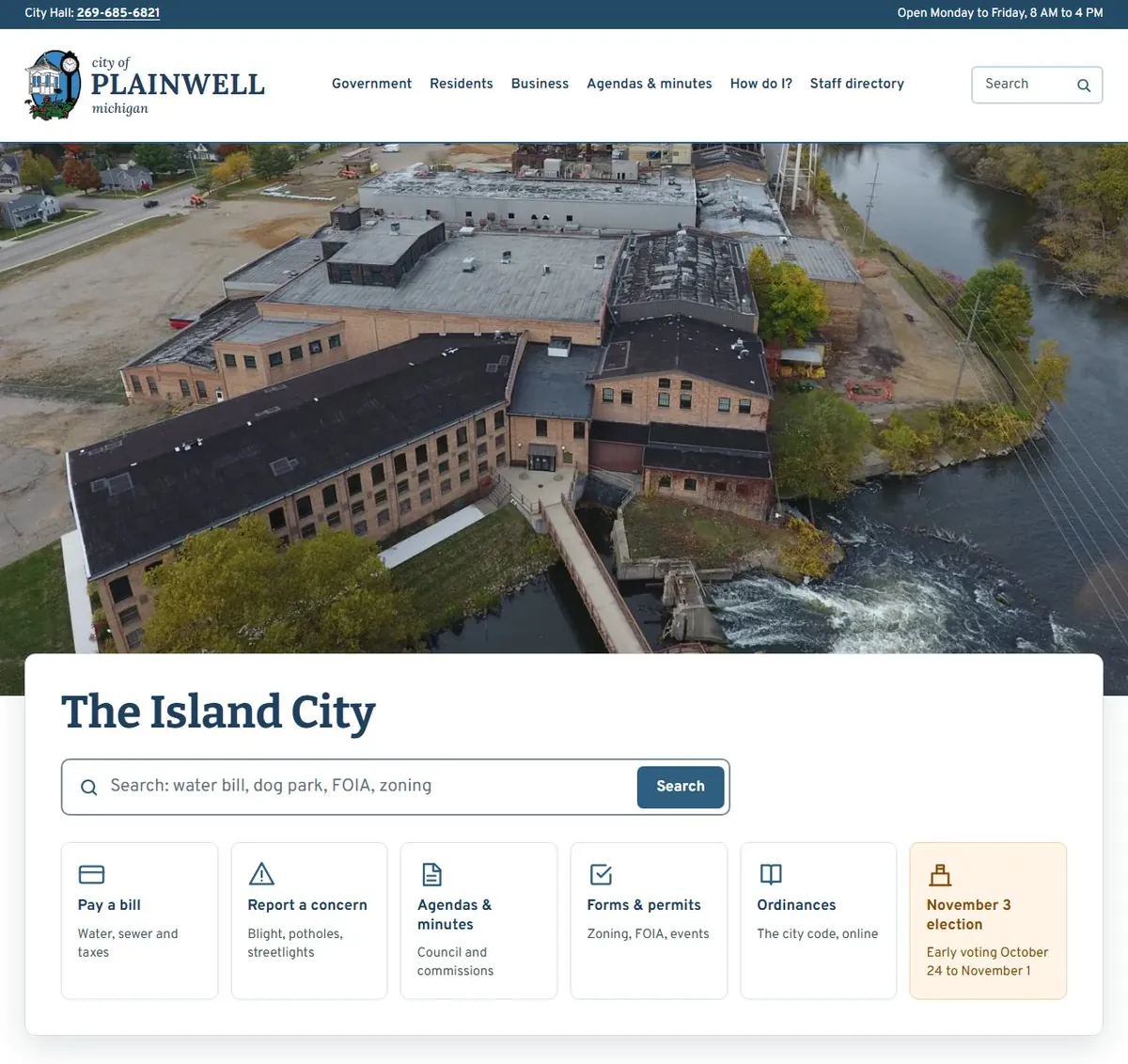 The new City of Plainwell homepage: a drone photo of City Hall and the dam, with search and six quick links
